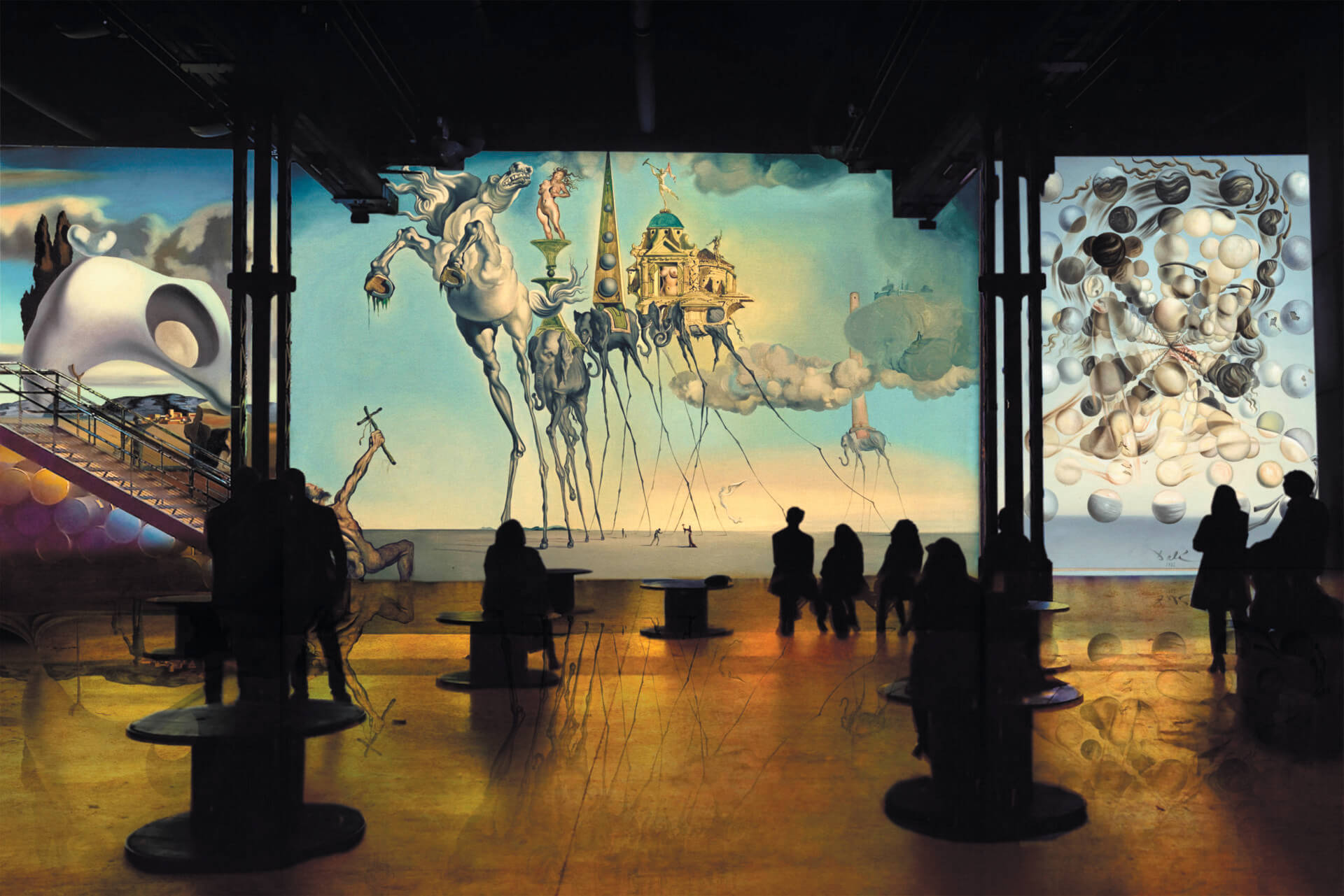 Three paintings from Dali projected on the walls 