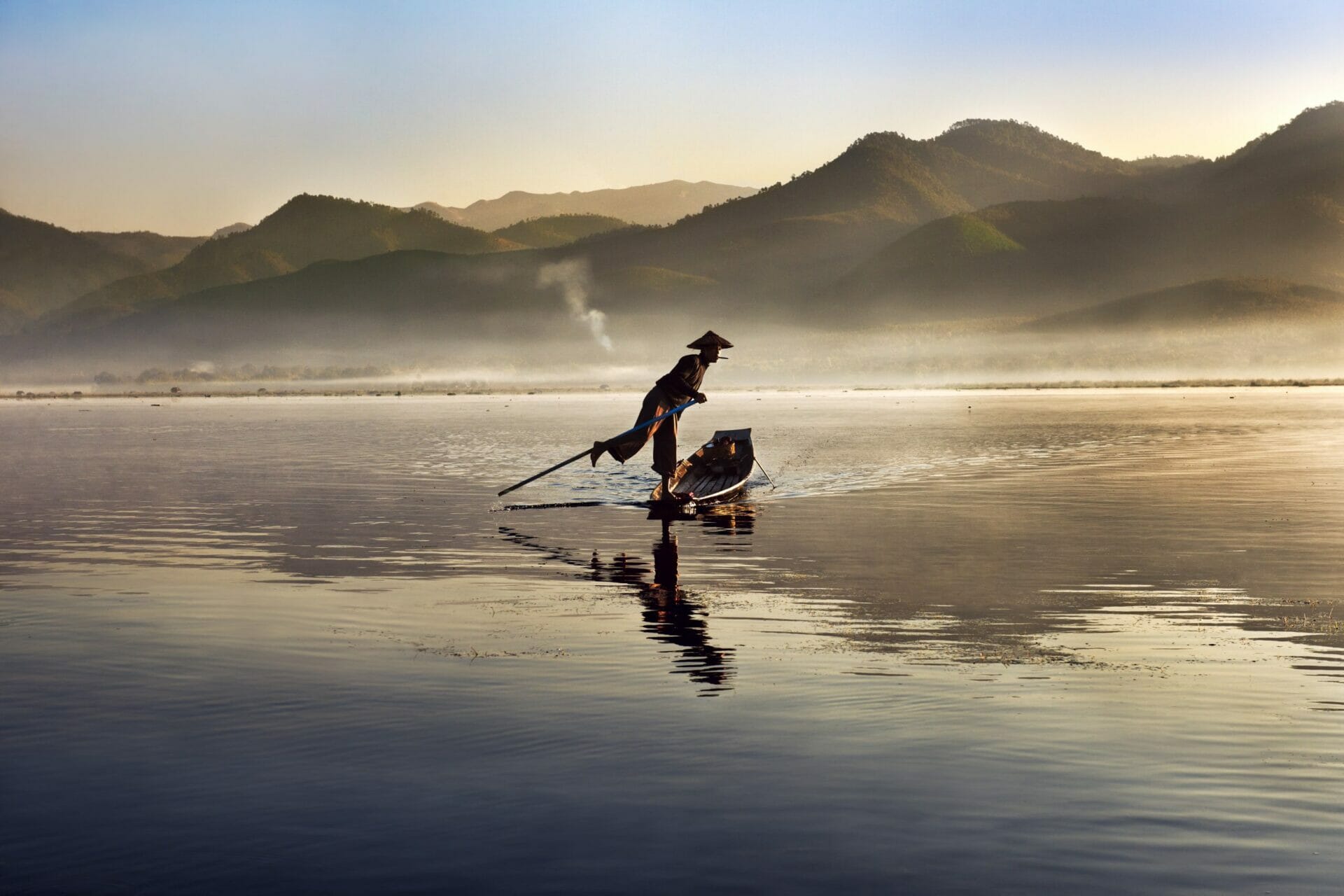 Photo taken by McCurry of a fisherman sailing on a lake in Myanmar
