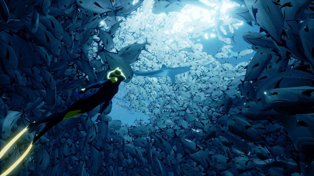 gameplay screenshot of Abzu; diving through a school of fish.